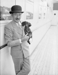 Adolphe Menjou Holding Daschund Aboard Ship